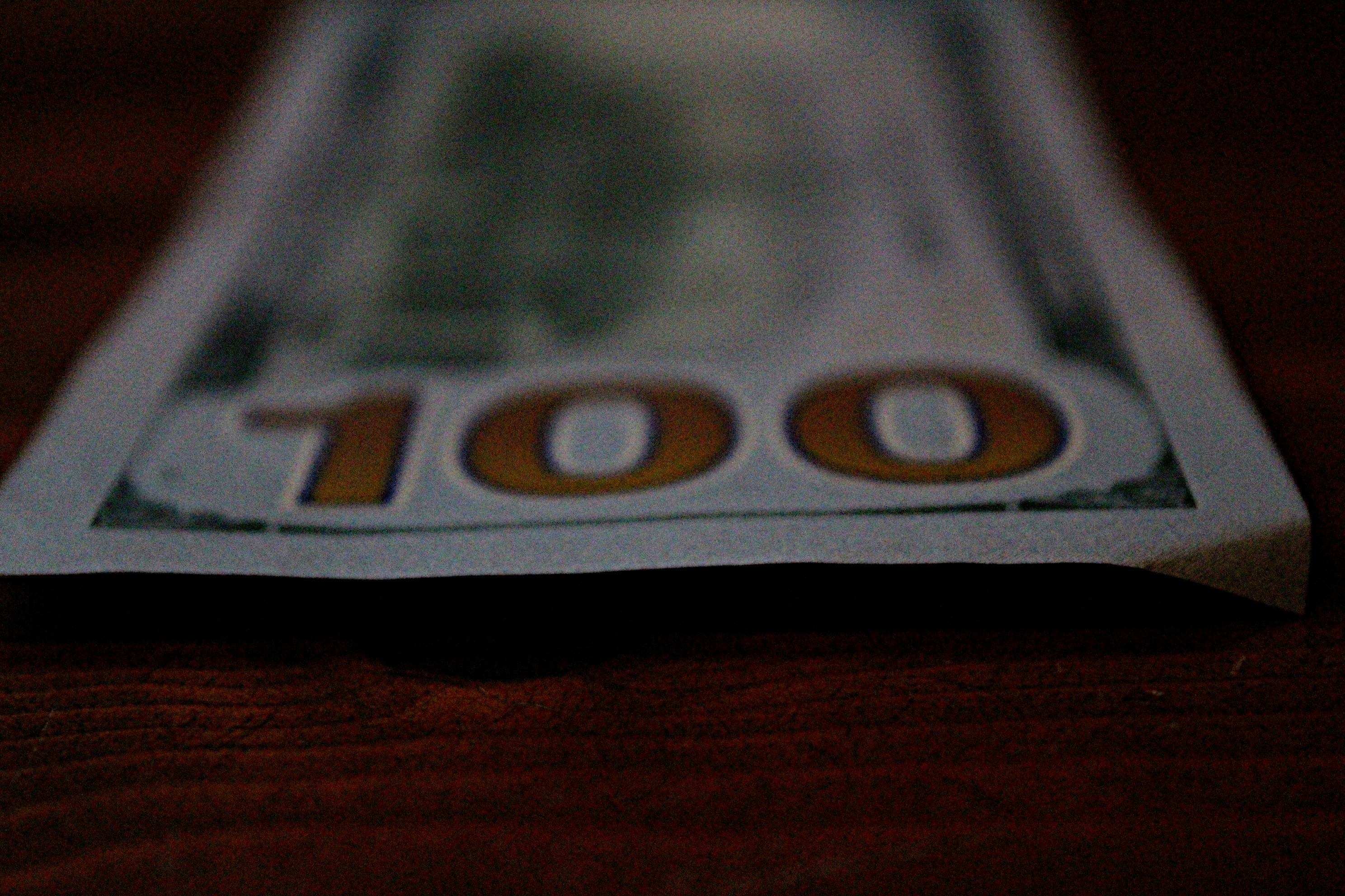 a close up of a hundred dollar bill